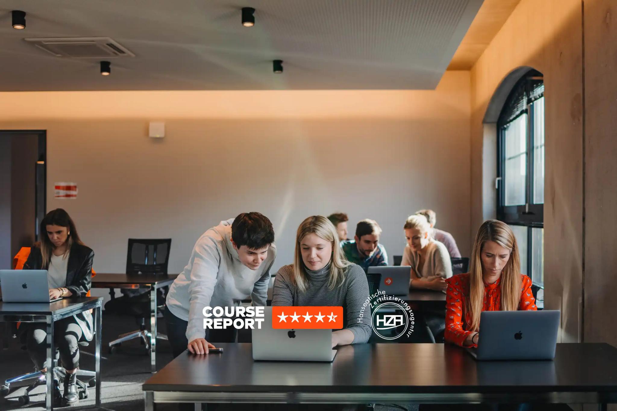 Students working on laptops in a modern classroom